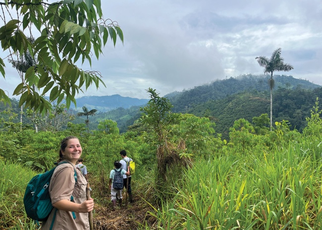 Madelyn Seward and TIERA Scholars hike through a rainforest