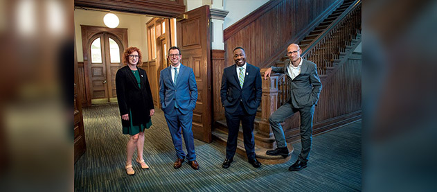 picture of the four new deans inside Gibson Hall.