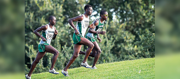 Emmanuel Rotich (center), team captain, keeps up the pace for cross country team members (left) Joshua Cheruyot and (right) Moses Aloiloi. Rotich took first place in the American Athletic Conference Championship for the second year in a row on Oct. 25. This year’s race was held in New Orleans in Audubon Park.