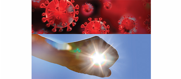 COVID-19 virus illustration above hand framing sunlight in the sky