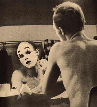 Vintage photo of former Professor of Theatre, J. Michael Miller, putting on stage makeup