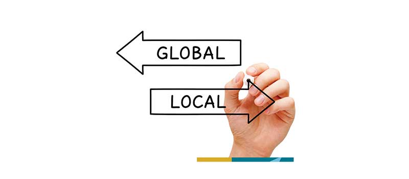 graphic of hand and arrows depicting interchange of global and local commerce