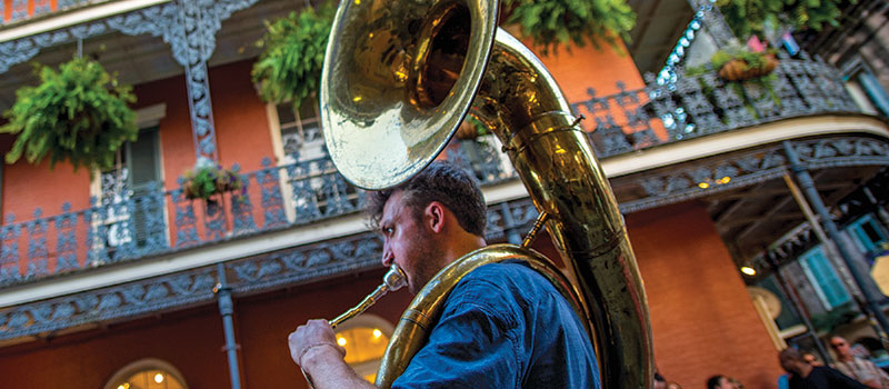 man playing a tuba in French Quarter