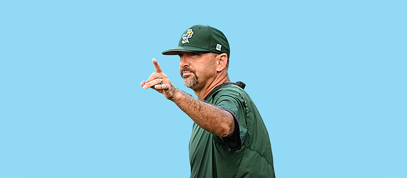 Baseball coach Jay Uhlman against a blue background