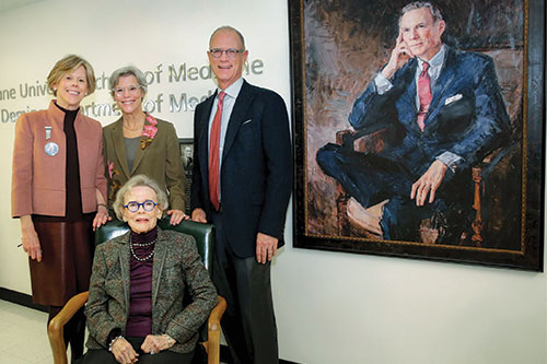 The Deming family in front of Dr. John Deming's portrait at the dedication