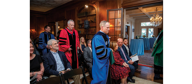 Dean Brian Edwards, Provost Robin Forman and Professor Michael Cohen process in academic regalia
