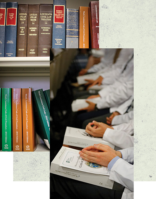 law books and close up of white coats 