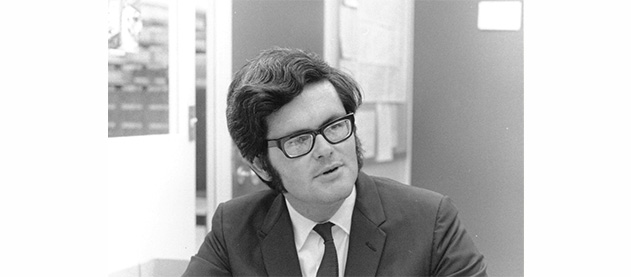 black and white photo of Newt Gingrich, in glasses, teaching in 1969