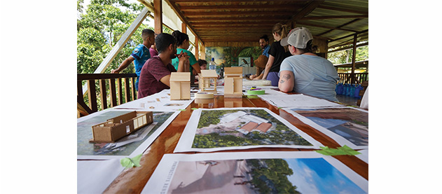 Tulane architecture students outside with renderings