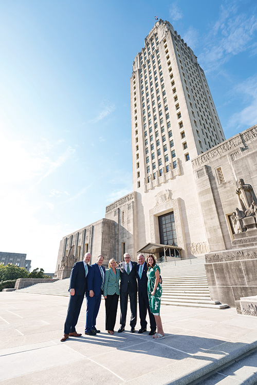 Tulane leaders stand outside in front of the Louisiana State Capitol