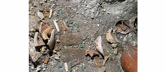 relics in excavation site of an ancient Maya tomb 