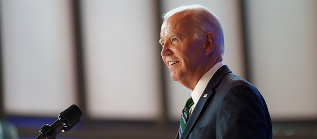 President Biden speaks at a podium