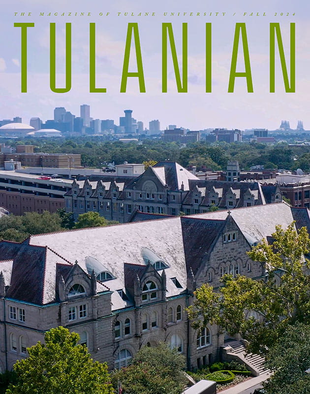 aerial view of Gibson Hall with downtown skyline in distance