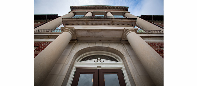 looking up at the door and columns of Newcomb Hall