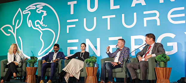 speakers on stage during a forum