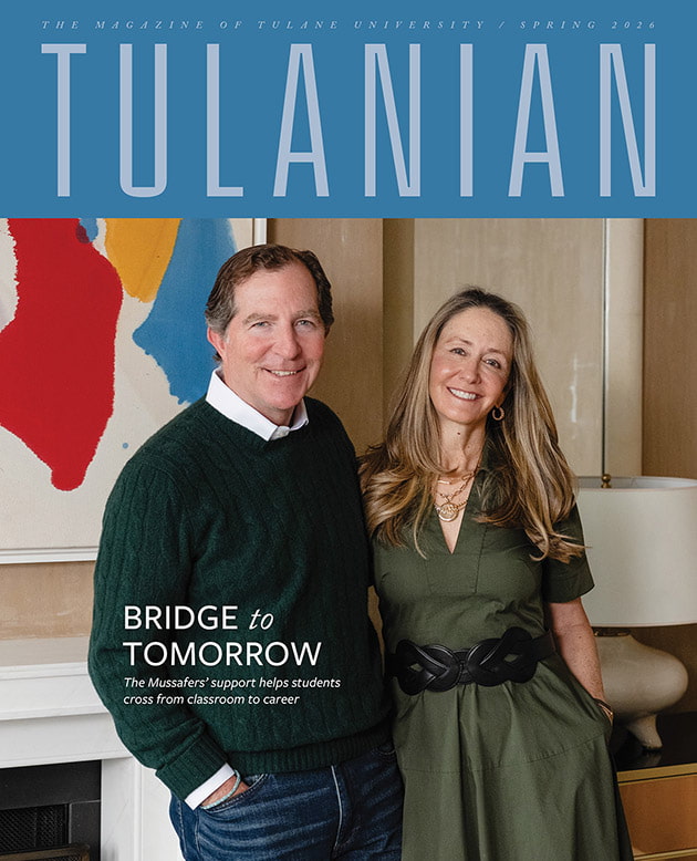 Tulane magazine cover with a smiling man in a green sweater and woman in a green dress.