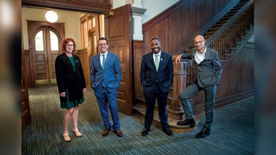 picture of the four new deans inside Gibson Hall.