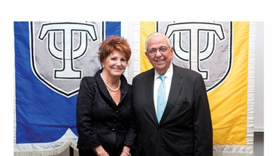 From left, Pierrette Phillips congratulates Dr. Raoul Rodriguez, who was invested as the inaugural holder of the Pierrette and John G. Phillips Professorship in Orthopaedics at the School of Medicine on November 13. 