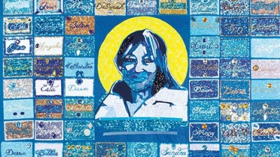 The Life Quilt (2018), sewn together by Louise Mouton Johnson, features the names of 107 women serving life sentences. The names were compiled by Selina Anderson of the Louisiana Correctional Institute for Women Drama Club and hand-beaded by members of Black Masking Indian gangs. The center portrait is of lifer Mary Turner by Brandan “BMike” Odums. (Photo courtesy Newcomb Art Museum)