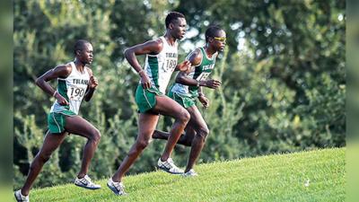 Emmanuel Rotich (center), team captain, keeps up the pace for cross country team members (left) Joshua Cheruyot and (right) Moses Aloiloi. Rotich took first place in the American Athletic Conference Championship for the second year in a row on Oct. 25. This year’s race was held in New Orleans in Audubon Park.