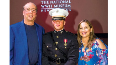 Tulane parents Stuart and Suzanne Grant, pictured with their son Sam in U.S. Marine Corps uniform