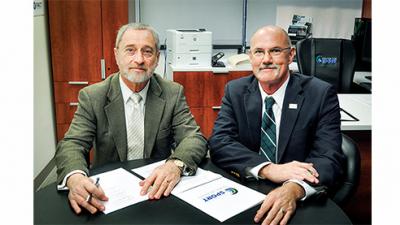 Dr. James Kelly, Avalon Fund representative, and Tulane’s Dr. Greg Stewart sign the agreement for the creation of the Center for Brain Health.