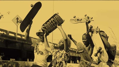 Young Black adults with skate boards at the opening of Parasite Park in Gentilly