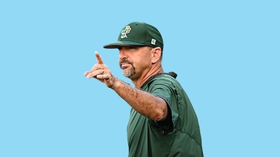 Baseball coach Jay Uhlman against a blue background