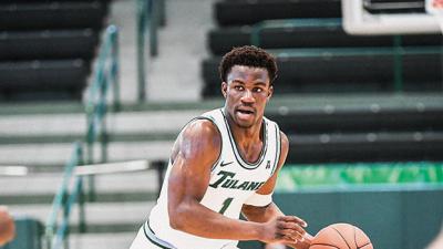 Green Wave's men basketball team guard Sion James on the court