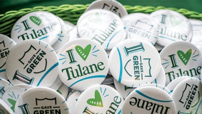 buttons printed with "I love Tulane" in a basket