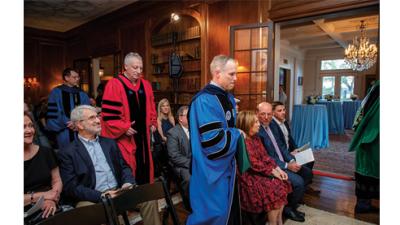 Dean Brian Edwards, Provost Robin Forman and Professor Michael Cohen process in academic regalia
