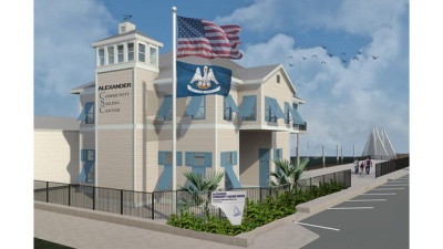 Alexander Community Sailing Center Rendering of the two-story Alexander Community Sailing Center that will overlook the Municipal Yacht Harbor. Sailboats on a lake in the background.