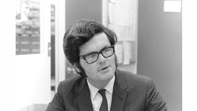 black and white photo of Newt Gingrich, in glasses, teaching in 1969