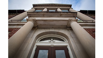 looking up at the door and columns of Newcomb Hall
