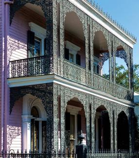 New Orleans mansion with a filigreed balcony and porch