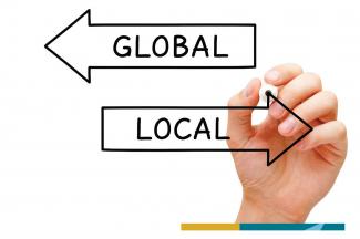 graphic of hand and arrows depicting interchange of global and local commerce