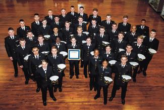 Tulane’s Navy ROTC Unit in uniform gathers in the lobby of the Navy ROTC building on Freret Street on the uptown campus for a group photo.