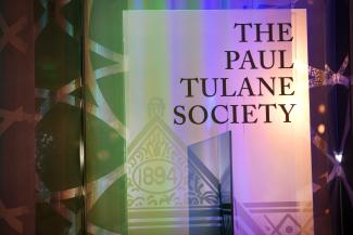 A standing banner at an event that reads "The Paul Tulane Society."