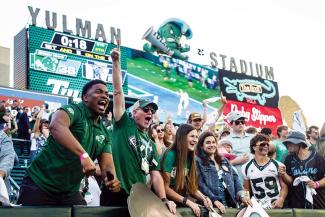 Fans in Yulman Stadium with scoreboard in background for Tulae vs. Memphis football, October 2022