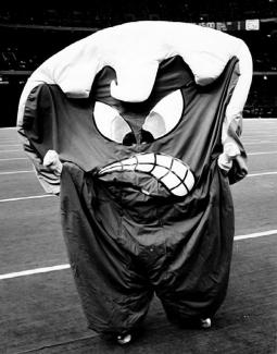 person dressed in a wave-shaped costume with an angry face 