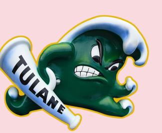 Angry Wave sculpture - a green wave with an angry face, balled-up fist and a Tulane megaphone