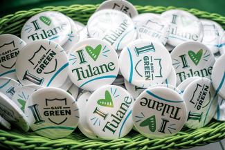 buttons printed with "I love Tulane" in a basket