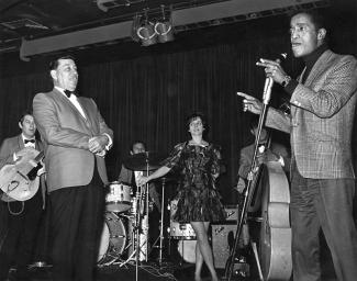 Prima and Gia on stage with Sammy Davis Jr. who is singing 