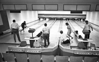black and white photo of students bowling in Tulane's bowling alley in 1967