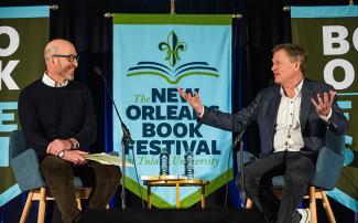 Journalist David Shipley and author Michael Lewis on stage during a panel. 