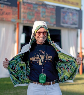 Bud Brimberg in front of Jazz Fest merchandise tent