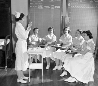 1950s nursing students watch a classroom demonstration