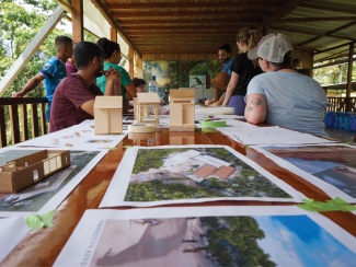 Tulane architecture students outside with renderings