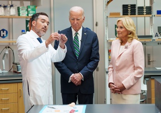 (Left) Quincy Brown, Tulane associate professor of biomedical engineering and leader of the MAGIC-SCAN project, demonstrate the President Joseph R. Biden Jr. (center) and First Lady Jill Biden (right) how the technology works. 