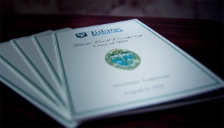 stack of programs for the ceremony